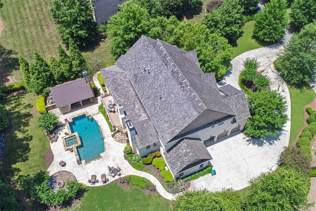 Aerial view of a home with a swimming pool